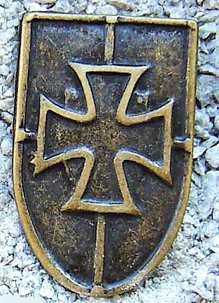 [N-260-21] Kreuz-Schild, altmessingfarbener Beschlag